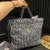 CNCB2-6df4f4d020f8.webp Chanel Large Backpack Printed Fabric And Gold Metal In Black And White 36Cm, Designer Handbags, Women’s Purse, luxury bags, Chanel bags