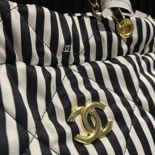 CNCB5-fddc0e80a588.webp Chanel Large Backpack Printed Fabric And Gold Metal In Black And White 36Cm, Designer Handbags, Women’s Purse, luxury bags, Chanel bags