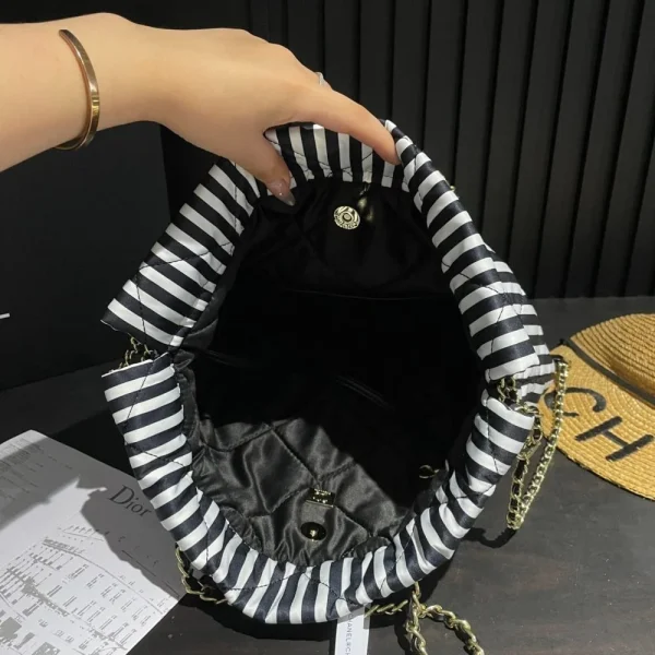 CNCB7-93ee7a57a3cd.webp Chanel Large Backpack Printed Fabric And Gold Metal In Black And White 36Cm, Designer Handbags, Women’s Purse, luxury bags, Chanel bags