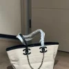 WhatsApp-Image-2026-07-16-at-10.53.09-1-1-d69d12ccd9c1.webp Chanel Small Tote Canvas, Calfskin & Gold-Tone Metal 45cm/17.7in Ecru & Black AS6285