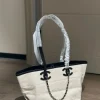 WhatsApp-Image-2026-07-16-at-10.53.09-2-b0de0594078e.webp Chanel Small Tote Canvas, Calfskin & Gold-Tone Metal 45cm/17.7in Ecru & Black AS6285