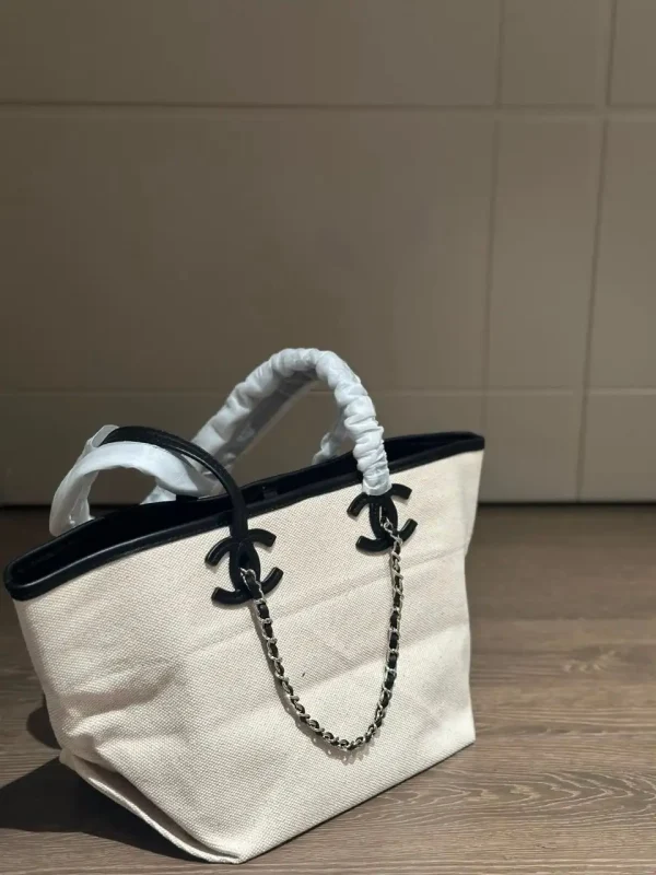 WhatsApp-Image-2026-07-16-at-10.53.10-2-1-44db7a2997a4.webp Chanel Small Tote Canvas, Calfskin & Gold-Tone Metal 45cm/17.7in Ecru & Black AS6285