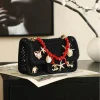 WhatsApp-Image-2026-07-16-at-10.59.37-3-1-5c1a72d7c160.webp Chanel Small Flap Bag Mesh, Charms & Gold-Tone Metal 21cm/8.3in Black AS6156