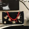 WhatsApp-Image-2026-07-16-at-10.59.37-9-6370e7781f64.webp Chanel Small Flap Bag Mesh, Charms & Gold-Tone Metal 21cm/8.3in Black AS6156