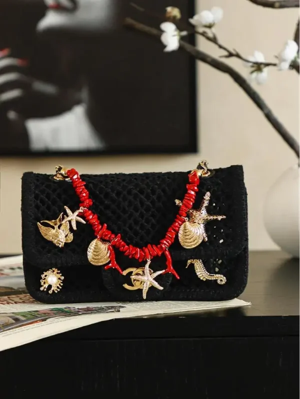 WhatsApp-Image-2026-07-16-at-10.59.37-9-6370e7781f64.webp Chanel Small Flap Bag Mesh, Charms & Gold-Tone Metal 21cm/8.3in Black AS6156