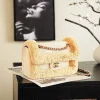 WhatsApp-Image-2026-07-16-at-11.00.05-1-1-364614ffe6b6.webp Chanel Foldable Flap Bag Braided Raffia Yarn & Gold-colored Metal 25cm/9.8in Beige AS6163