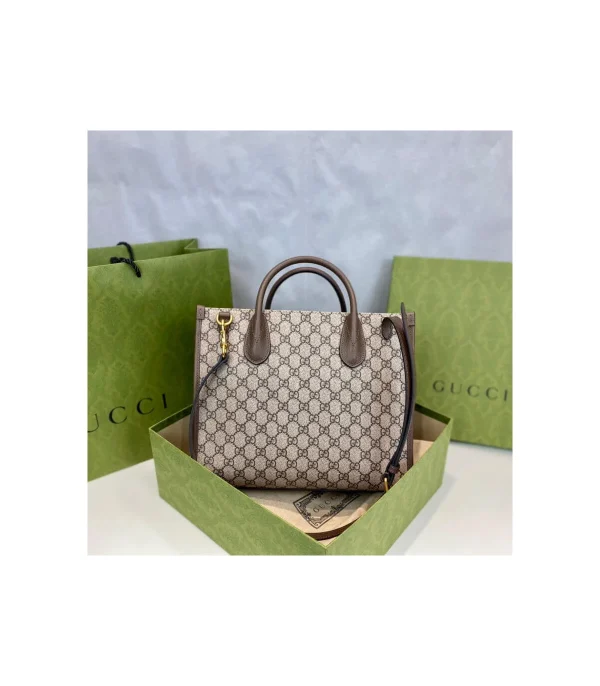 disney-x-gucci-donald-duck-tote-bag-4-fd2033bbe488.webp Gucci Beige GG Supreme Canvas Donald Duck Tote Bag 31cm