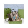 disney-x-gucci-donald-duck-tote-bag-7-304ed86d7211.webp Gucci Beige GG Supreme Canvas Donald Duck Tote Bag 31cm