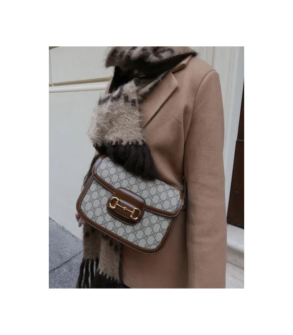 gucci-1955-horsebit-brown-gg-supreme-canvas-shoulder-bag-1-e32e5a5ad472.webp Gucci 1955 Horsebit Brown GG Supreme Canvas Shoulder Bag 25cm