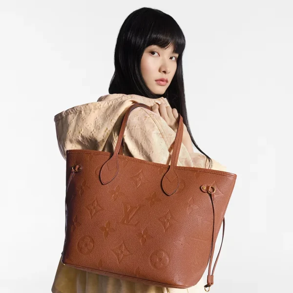 louis-vuitton-neverfull-mm-M12605_PM1_Worn_20view-b59b0c6c6845.webp Louis Vuitton Neverfull Mm Tote Bag Cognac Brown 31cm M12605, Designer Handbags, Womens Purse, luxury bags